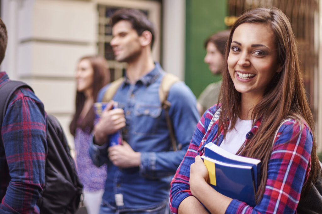 Female student holding books